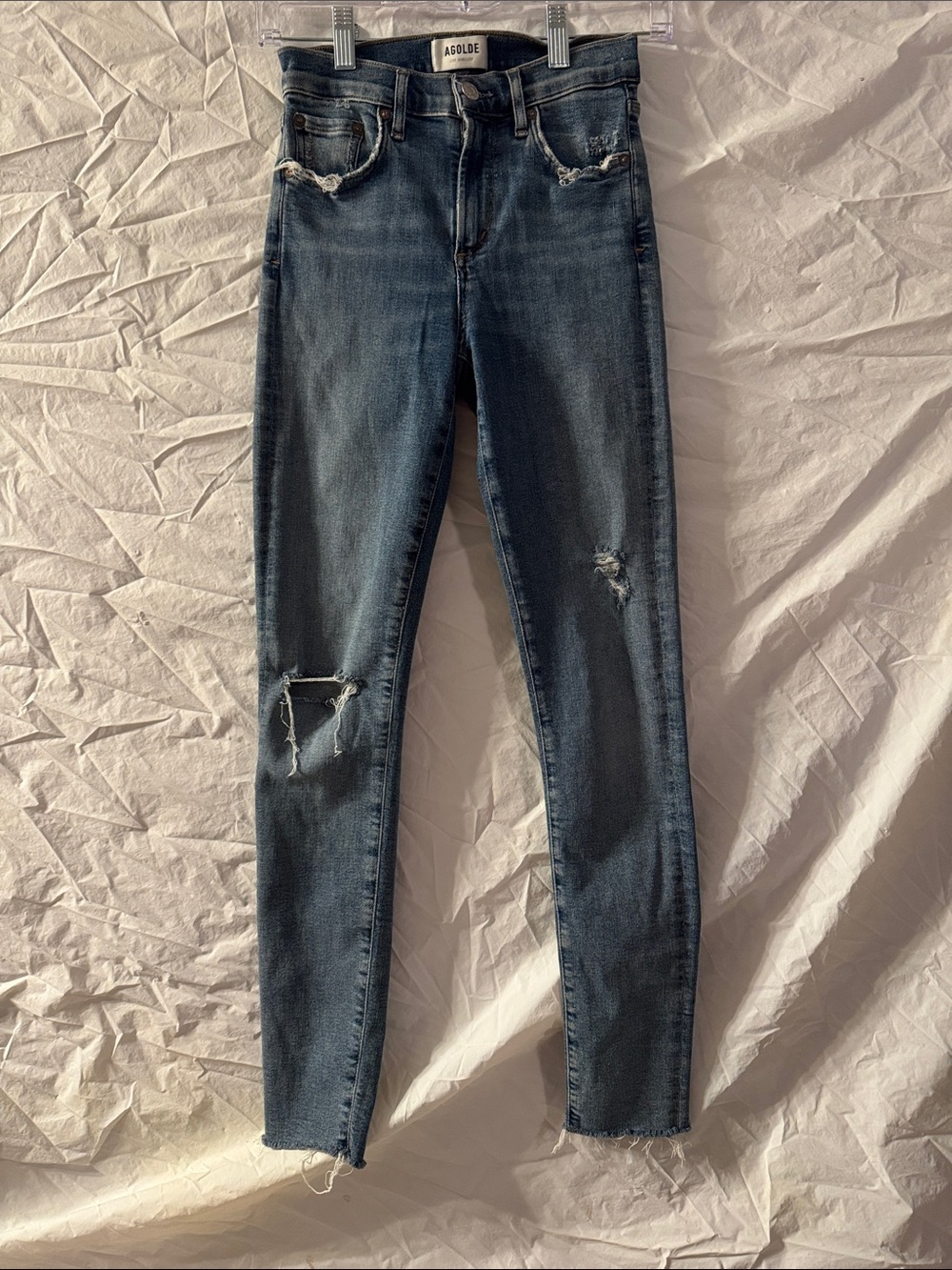 AGOLDE distressed Sophie skinny jeans featuring a raw cut hem